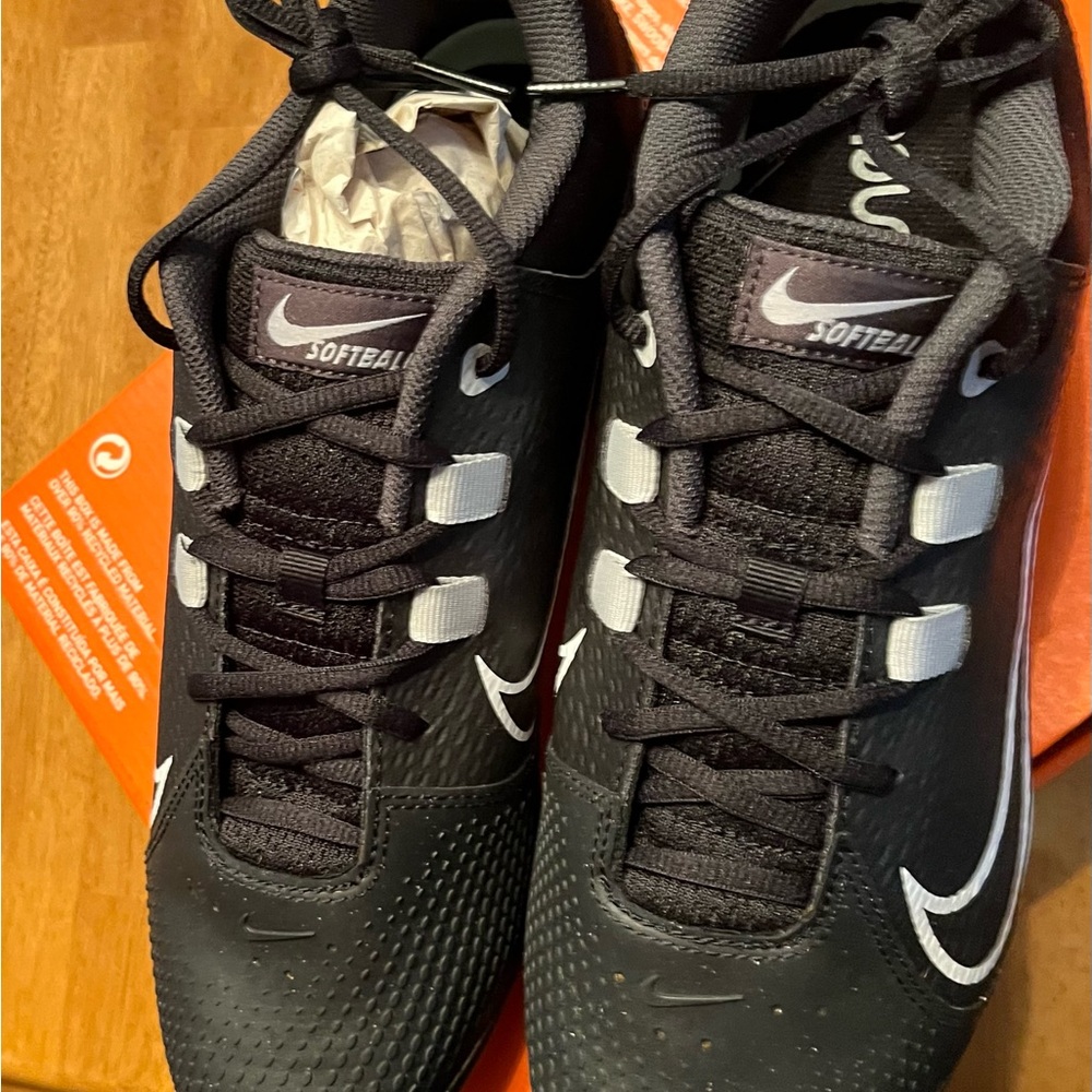 Nike Black and White Athletic cleats with Reflective Accents